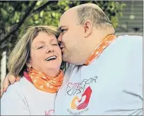  ?? SUBMITTED PHOTO ?? Douglas Dunne kisses his mother, Clara, following the Active for Autism Walk held in Renews in 2017.