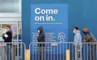  ?? PATRICK T. FALLON/AFP VIA GETTY IMAGES ?? Customers wear face masks while waiting in line to shop inside a Best Buy in Hawthorne, Calif., on Black Friday, Nov. 27.