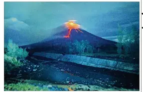  ?? DAN AMARANTO / ASSOCIATED PRESS ?? Lava cascades down the slopes of the Mayon volcano about 210 miles southeast of Manila, Philippine­s, on Tuesday. The Philippine Institute of Volcanolog­y and Seismology said the lava flowed as much as 1.2 miles from the crater.