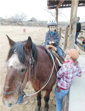  ?? LISA KADANE/POSTMEDIA NEWS ?? Buckaroo Bennett, 5, is saddled up and ready to ride at Tanque Verde Ranch, east of Tucson, Ariz.