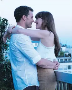  ?? UNIVERSAL PICTURES ?? Jamie Dornan, left, and Dakota Johnson star in the finale of the Fifty Shades trilogy ... and still have zero chemistry.