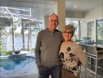  ?? COURTESY OF THAD SEYMOUR ?? Empty nesters Thad and Katie Seymour are selling their lakefront Florida home and using the proceeds to buy two smaller homes. They plan to summer in Wisconsin near family, and winter in Florida.