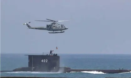  ??  ?? File photo of the KRI Nanggala taking part in a drill in 2017. A search is under way for the submarine, which the Indonesian navy says may have sunk to a depth of 600-700 meters. Photograph: AP