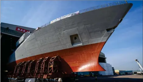  ??  ?? The forward section of HMS Glasgow – the first of the new generation, cutting edge City Class Type 26 frigates being built for the Royal Navy – is rolled out of the build hall at BAE Systems shipyard on the River Clyde