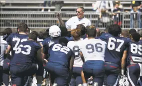  ?? Jessica Hill / Associated Press ?? UConn coach Randy Edsall talks with his team at the end of the Huskies’ spring game on Saturday in East Hartford.