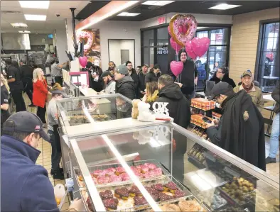  ??  ?? Many people came out for the opening of the “Next Generation” Dunkin’ in Milford on Friday.