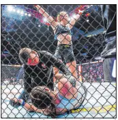  ?? L.E. Baskow Las Vegas Review-journal ?? Valentina Shevchenko celebrates her knockout of Lauren Murphy at a UFC event at T-mobile Arena in 2021.