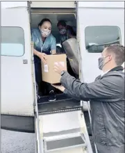  ?? Photo courtesy of Hawaii Department of
Health ?? A shipment of COVID-19 vaccines by Moderna is delivered to the Kalaupapa Settlement on Molokai by Mokulele Airlines.