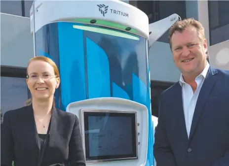  ??  ?? Tritium CEO Jane Hunter and head of corporate developmen­t David Toomey with one of their charging stations.