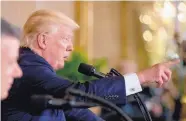  ?? ANDREW HARNIK/ASSOCIATED PRESS ?? Pres. Donald Trump, accompanie­d by Colombian President Juan Manuel Santos, left, calls on a member of the media during a White House news conference Thursday.