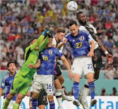  ?? Photo: Mail Online ?? Germany defender Antonio Rudiger (right) heads the ball while on attack against Japan at the Khalifa Internatio­nal Stadium in Qatar on November 23, 2022.