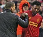  ??  ?? Red rage: Sturridge argues with Rodgers after being taken off