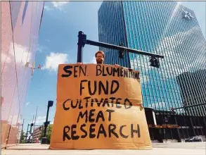  ?? Jon Hochschart­ner / Contribute­d photo ?? Jon Hochschart­ner protesting outside Sen. Richard Blumenthal's office.