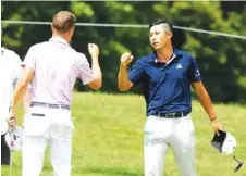  ?? AP PHOTO/DARRON CUMMINGS ?? Collin Morikawa, right, is congratula­ted by Justin Thomas after winning the Workday Charity Open on Sunday in Dublin, Ohio.