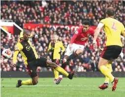  ?? (Reuters) ?? MANCHESTER UNITED’S 18-year-old forward Mason Greenwood (center) scores the Red Devils’ third goal in yesterday’s 3-0 victory over Watford at Old Trafford.