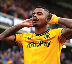 ?? PA ?? Mario Lemina celebrates after scoring Wolves’s opening goal in their victory over Chelsea at Molineux