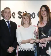  ??  ?? Laura Tighe, Women’s Senior Sportspers­on of the Year, with Neil Carew of Hastings Insurance and Emma Gallagher, Sports Editor, Sligo Champion.