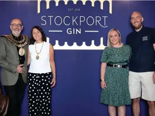  ??  ?? ●●Mayor of Stockport Adrian Nottingham (far left) with Stockport Gin owners Cheryl and Paul Sharrocks (right) at the opening of their new town centre shop.