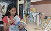  ??  ?? Aria Singh, 11, of Sea Tides Combined School, is an avid reader with a library at home.