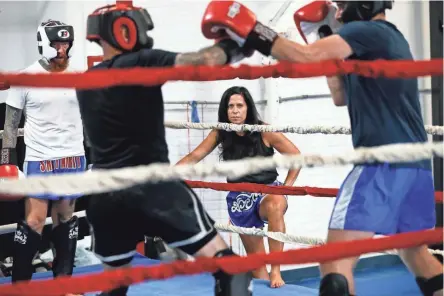  ?? ADAM CAIRNS/COLUMBUS DISPATCH ?? Short North Muay Thai owner Hope Vitellas keeps an eye on students practicing at her Grandview Heights-area gym. Vitellas was recently the only woman head coach at a national competitio­n where her fighters brought home five championsh­ip belts.