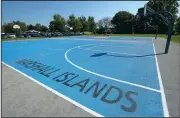  ?? NWA Democrat-Gazette/ANDY SHUPE ?? The outdoor basketball court at The Jones Center in Springdale as seen Saturday features a map of the Marshall Islands and a large compass rose.