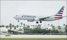  ?? WILFREDO LEE — THE ASSOCIATED PRESS FILE ?? American Airlines said it continues to struggle with a sharp downturn in travel because of the pandemic. Flight attendants will bear the heaviest of the airline’s planned job cuts, with 8,100 losing their jobs.