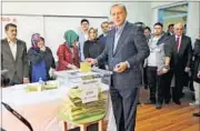  ??  ?? Turkey’s President Recep Tayyip Erdogan casts his vote at a polling station in Istanbul on Sunday.