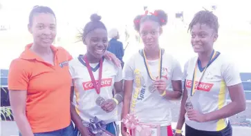  ??  ?? From left: Anika Jengelley, Mayberry Investment­s VP of marketing, poses for a picture with the 100-metre hurdle winners, silver medallist Oneika Wilson of Hydel High, gold medallist Gabrielle Matthews of Queens High School, and bronze medallist Velecia Williams, also of Hydel High at the SW Isaac Henry Invitation­al Saturday, February 16, at the National Stadium.