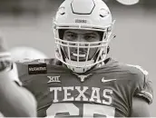  ?? John Rivera / Getty Images ?? Texas center Jake Majors has made a big impression as a freshman starter on the Longhorns’ line.