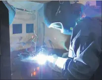  ?? SAM MCNEISH/THE TELEGRAM ?? Hayley Martin, a powerline student at the College of the North Atlantic’s Seal Cove campus, tries her hand at welding during the Skills Canada Newfoundla­nd and Labrador’s Annual Skilled Career Day at the Prince Philip Drive campus on Friday.