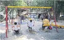  ??  ?? Children play at a public park and playground in Yankin, a suburb of Yangon, which has been designed with the help of a group of young girls.