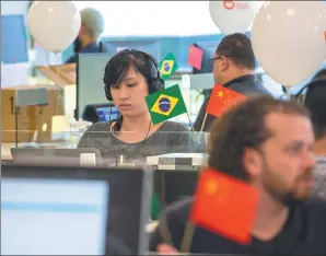  ?? PROVIDED TO CHINA DAILY ?? Employees of Didi Chuxing, China’s largest ride-hailing company, at work at their offices in Sao Paulo, Brazil.