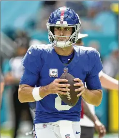  ?? AP FILE ?? New York Giants quarterbac­k Daniel Jones (8), shown warming up Oct. 8 before the game against Miami where he sustained a neck injury, will miss his third game. Instead Tyrod Taylor will start against the Jets on Sunday.