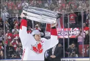 ?? BRUCE BENNETT — THE ASSOCIATED PRESS ?? Canada’s Sidney Crosby hoists the trophy after his team won the World Cup of Hockey in 2016.