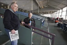  ?? NATI HARNIK - THE ASSOCIATED PRESS ?? Ron Tenski and Jerry Moritz, left, who had arrived to Fonner Park in Grand Island, Neb., for the horse races, Saturday, March 14, 2020, leave after the races were called off due to dangerous track conditions following snowfall.
