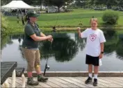  ?? TAWANA ROBERTS — THE NEWS-HERALD ?? Nathan Andree, who is 9 years old, caught a fish in a pond at Lake Metroparks Farmpark during FarmFest.