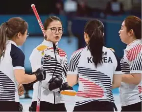  ?? AFP Filepic. ?? Members of the South Korea curling team at last year’s Pyeongchan­g Winter Olympics.