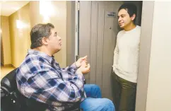  ?? Azin Ghafa ri / Postmedia News ?? Liberal candidate Kent Hehr (Calgary Centre) speaks with a voter at Sasso Condo in Calgary.