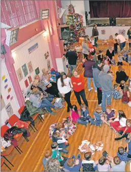  ?? 01_B51brodick­01 ?? Children enjoy a game of pass the parcel.