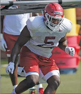  ?? Andy Shupe/NWA Democrat-Gazette ?? Defensive drills: Arkansas defensive lineman Dorian Gerald works through a drill during practice earlier this month at the university practice field in Fayettevil­le.