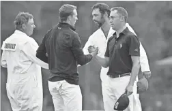  ??  ?? Jordan Spieth shakes hands with Justin Thomas after the final round of the Masters at Augusta National Golf Club. MICHAEL MADRID/USA TODAY SPORTS