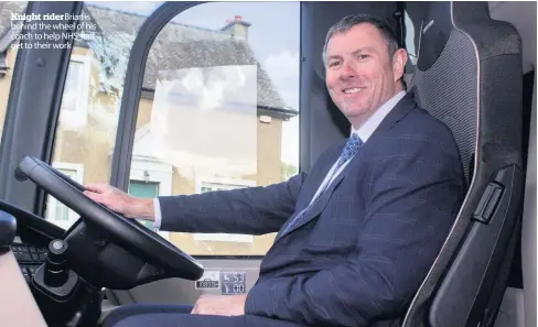  ??  ?? Knight rider Brian is behind the wheel of his coach to help NHS staff get to their work