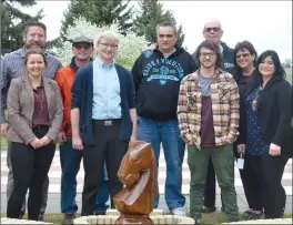  ?? NEWS PHOTO MO CRANKER ?? Representa­tives from the Medicine Hat Chess Club, CORE Associatio­n and a couple of chess ambassador­s stand for a photo at the giant chess set downtown. The chess board will be opening for the season Monday.