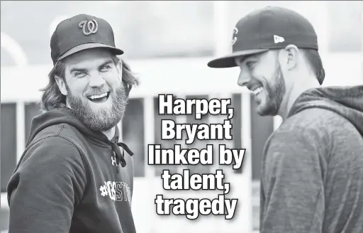  ?? AP ?? FRIENDS TURNED FOES: Las Vegas natives Bryce Harper (left) and Kris Bryant laugh Thursday in Washington as the Nationals and Cubs prepare to square off Friday in Game 1 of the National League Division Series.