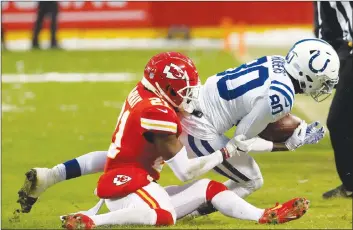  ?? AP PHOTO ?? Kansas City Chiefs safety Eric Murray (21) tackles Indianapol­is Colts wide receiver Chester Rogers (80) during the first half of an NFL divisional football playoff game in Kansas City, Mo., Saturday.