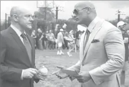  ?? HANDOUT, TNS ?? Rob Corddry, left, and Dwayne "The Rock" Johnson in a scene from HBO’s Ballers, one of the shows that has been hacked.
