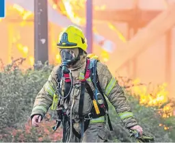  ?? Picture: Steve MacDougall. ?? A firefighte­r at the scene of the blaze in Hilltown, Dundee, last month.