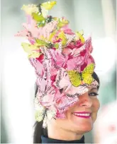  ??  ?? A colourful hat constructe­d from wafer-thin mock butterflie­s made an appearance at Epsom Derby Ladies’ Day yesterday. The flat racing event traditiona­lly opens on the first Friday in June.