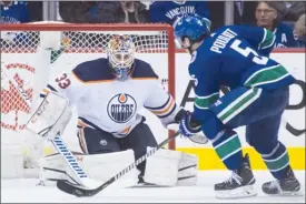  ?? The Canadian Press ?? Edmonton Oilers goaltender Cam Talbot allows the game-winning goal to Vancouver Canucks defenceman Derrick Pouliot during third-period NHL action in Vancouver on Thursday night.