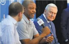  ?? Mark J. Terrill / Associated Press ?? Jerry West (right) was lured away from the Warriors by the Clippers, represente­d by head coach Doc Rivers at center.